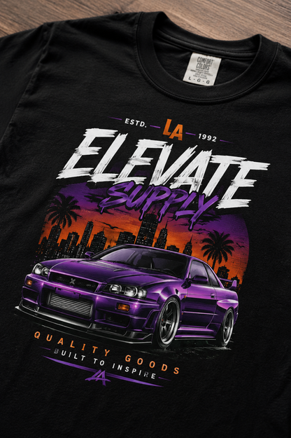 Black t-shirt with a DTF printed purple car graphic and 'Elevate Supply' text on a wooden surface