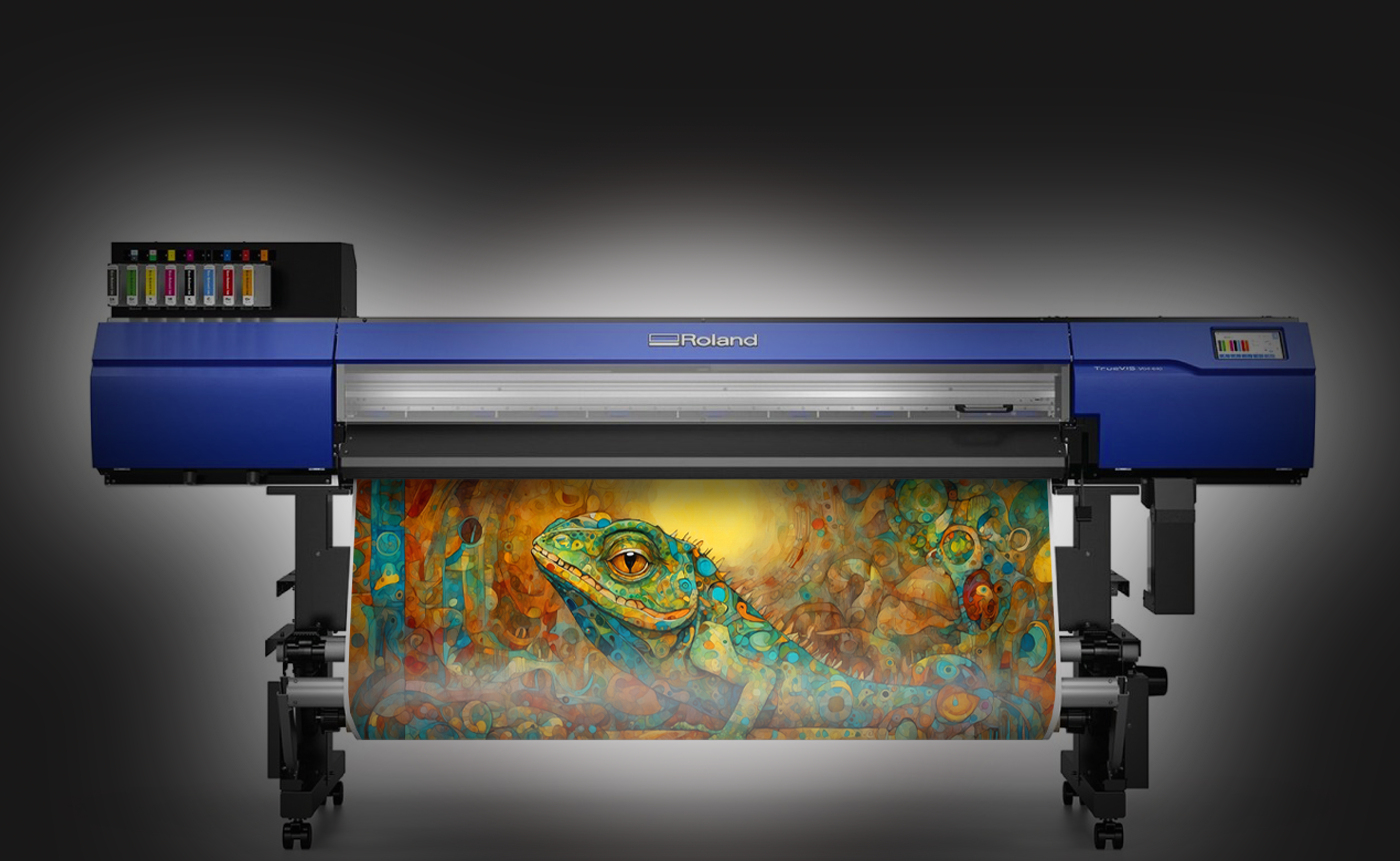 Roland printer with a colorful lizard artwork on a dark background